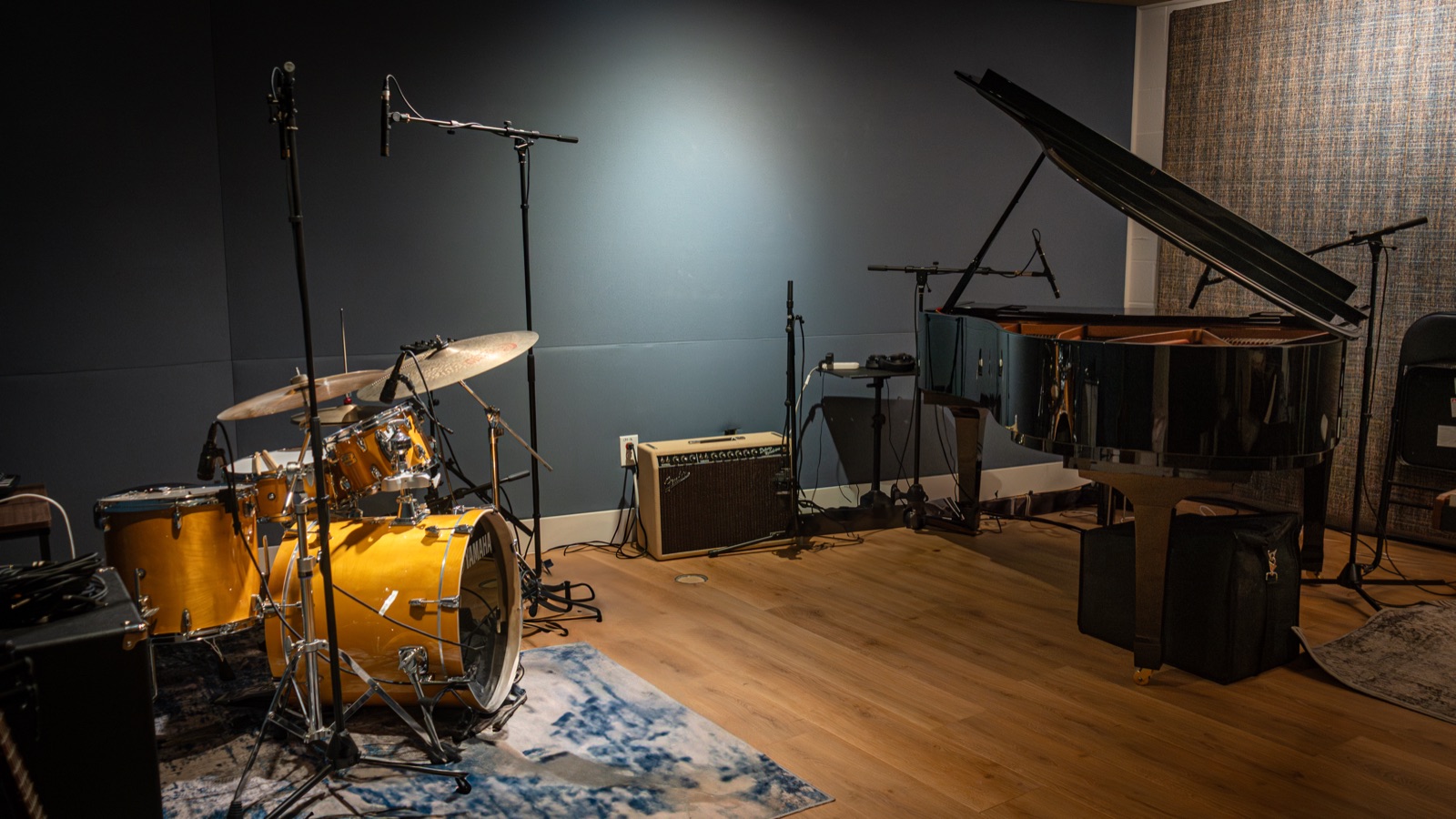The Recording Room, with the Yamaha grand piano and a drum kit set up